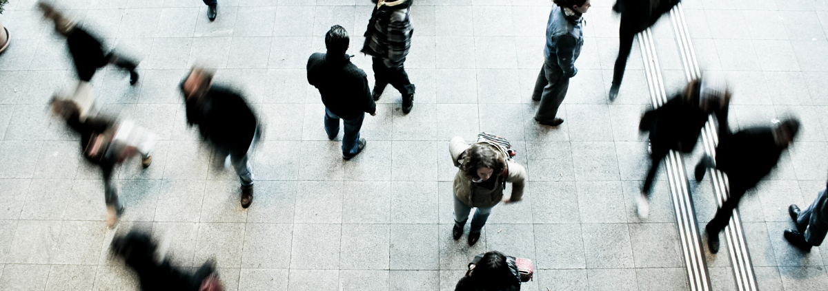 Featured image of people walking through a busy intersection