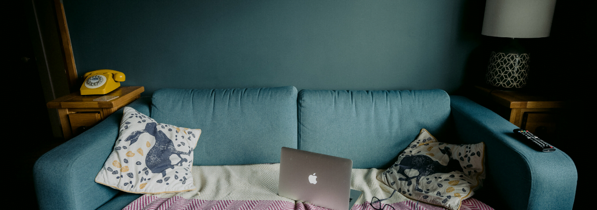 Couch and laptop of someone working from home